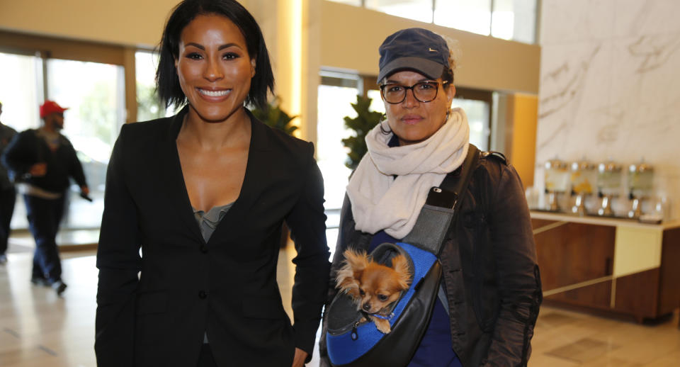 Cecilia Braekhus (L) arrives with her trainer, Lucia Rijker, at a news conference in Los Angeles on Wednesday, May 2, 2018. (AP)