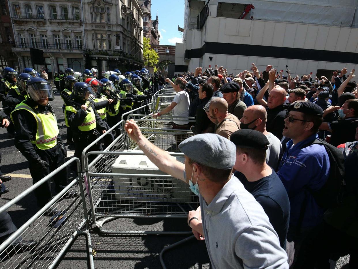 Police are confronted by protesters in Whitehall near Parliament Square, London: PA