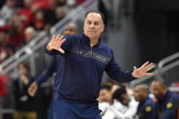 Notre Dame head coach Mike Brey sends instructions to his team during the second half of an NCAA college basketball game against Louisville in Louisville, Ky., Saturday, Jan. 22, 2022. Notre Dame won 82-70. (AP Photo/Timothy D. Easley)