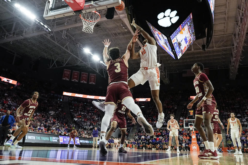 Clemson forward RJ Godfrey (10) shoots against Boston College guard Jaeden Zackery (3) during the first half of an NCAA college basketball game, Saturday, Jan. 13, 2024, in Clemson, S.C. (AP Photo/Mike Stewart)