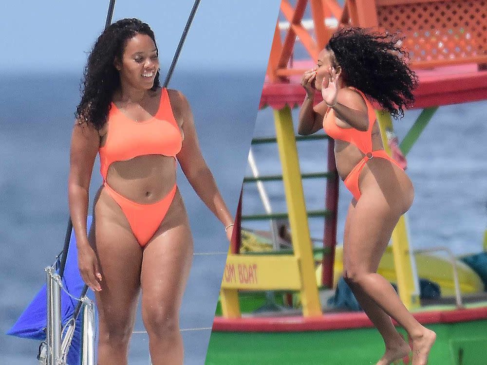 Angela Simmons in an orange monokini