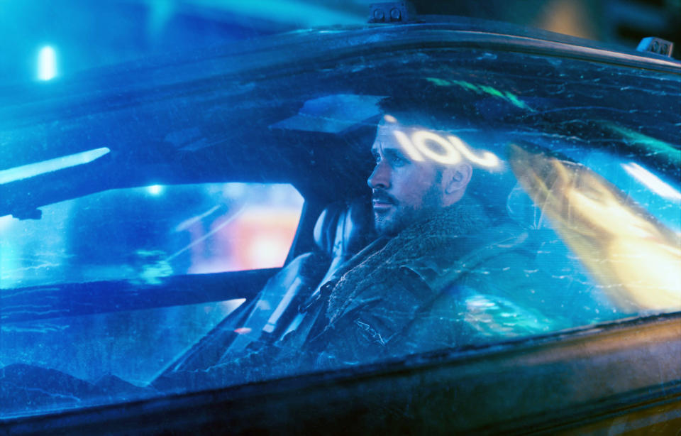 Ryan Gosling's character in a futuristic car