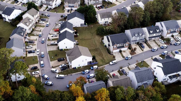 In this aerial image taken with a drone, law enforcement officers work at the scene of a shooting in Raleigh, North Carolina, on Oct. 13.