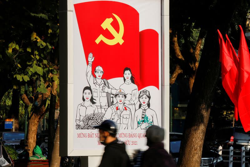 FILE PHOTO: A poster for the13th national congress of the Communist Party of Vietnam is displayed on a street in Hanoi