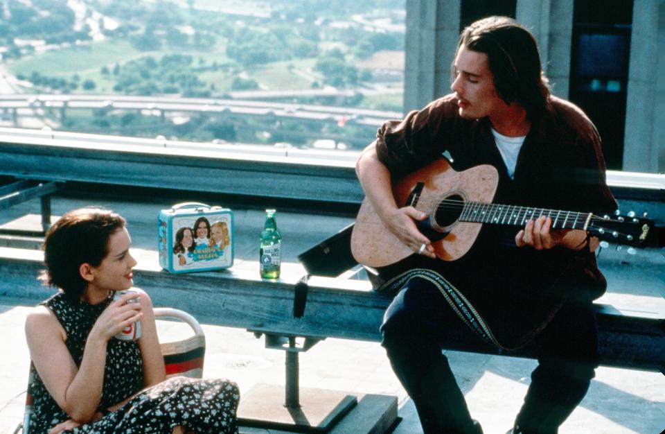 Winona Ryder watching Ethan Hawke play guitar.