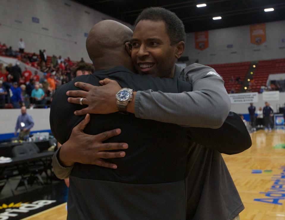 Florida High head coach Charlie Ward hugs Florida High athletic director Anthony Robinson Sr. following the Seminoles state championship win over Riviera Prep, 66-67, on March 4, 2022, at R.P. Funding Center.