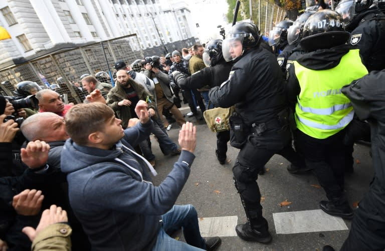 Protesters clash with police during a Ukrainian opposition rally demanding action on state corruption