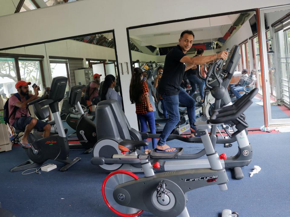 A man tries gym equipment inside the President's house gym, on the following day after demonstrators entered the building, after President Gotabaya Rajapaksa fled, amid the country's economic crisis, in Colombo, Sri Lanka July 10, 2022.