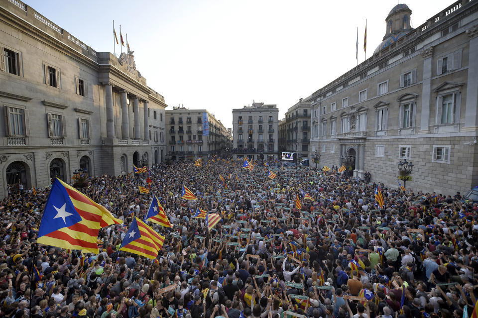 People gather to celebrate at Sant Jaume Square in Barcelona.