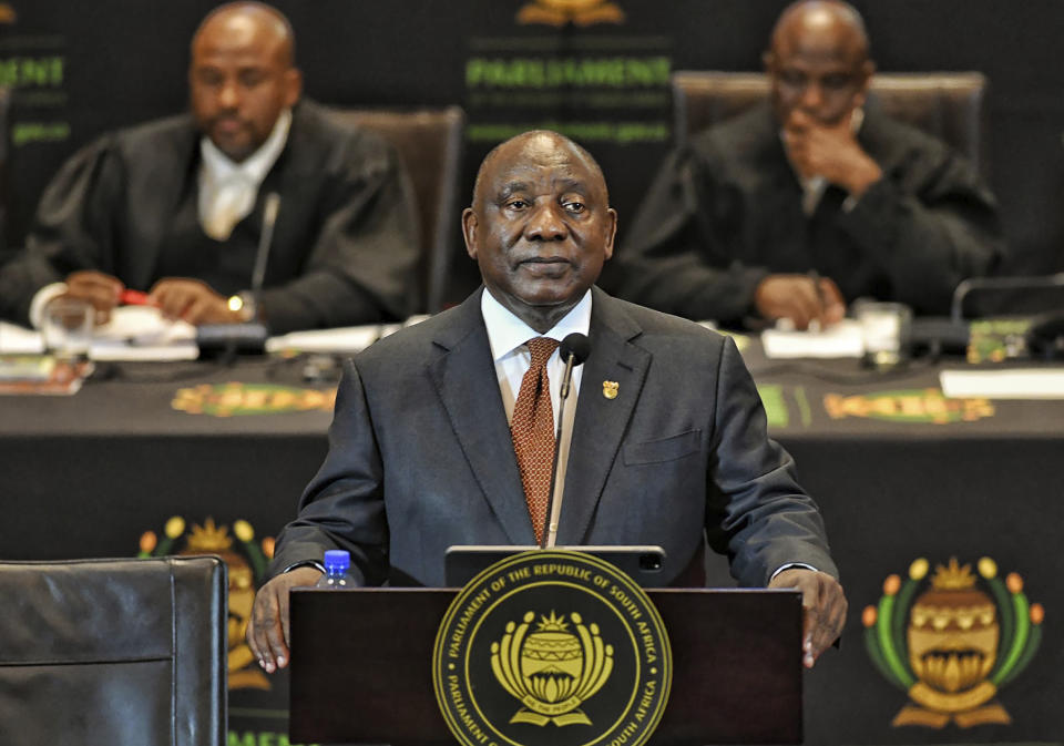 This photo supplied by the Government Communication and Information Services (GCIS), South African President, Cyril Ramaphosa, delivers his State of the Nation address to MP's in Cape Town, South Africa, City Hall Thursday, Feb. 9, 2023. Ramaphosa is under pressure to convince the country that his government is addressing the nation's dire electricity crisis and bleak economic outlook in his annual State of the Nation Address. (GCIS via AP)