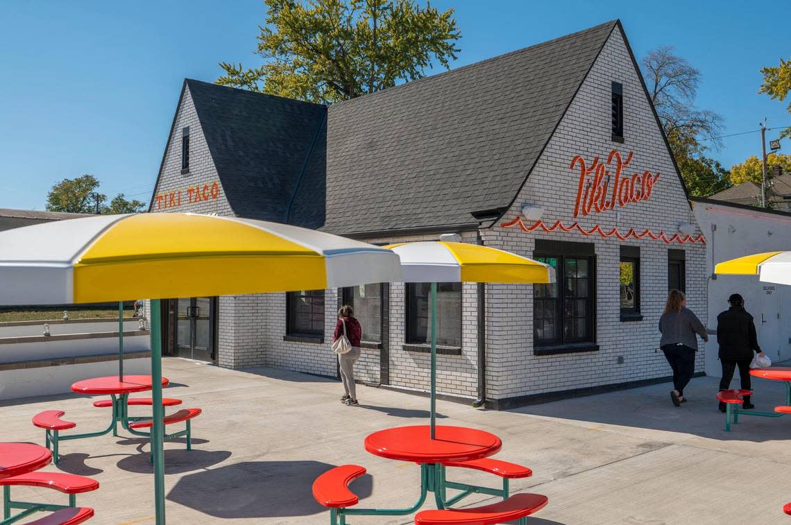 Bright yellow and red umbrella patio sets adorn the outside dining area at Tiki Taco, on the corner of Troost and East 54th Street.