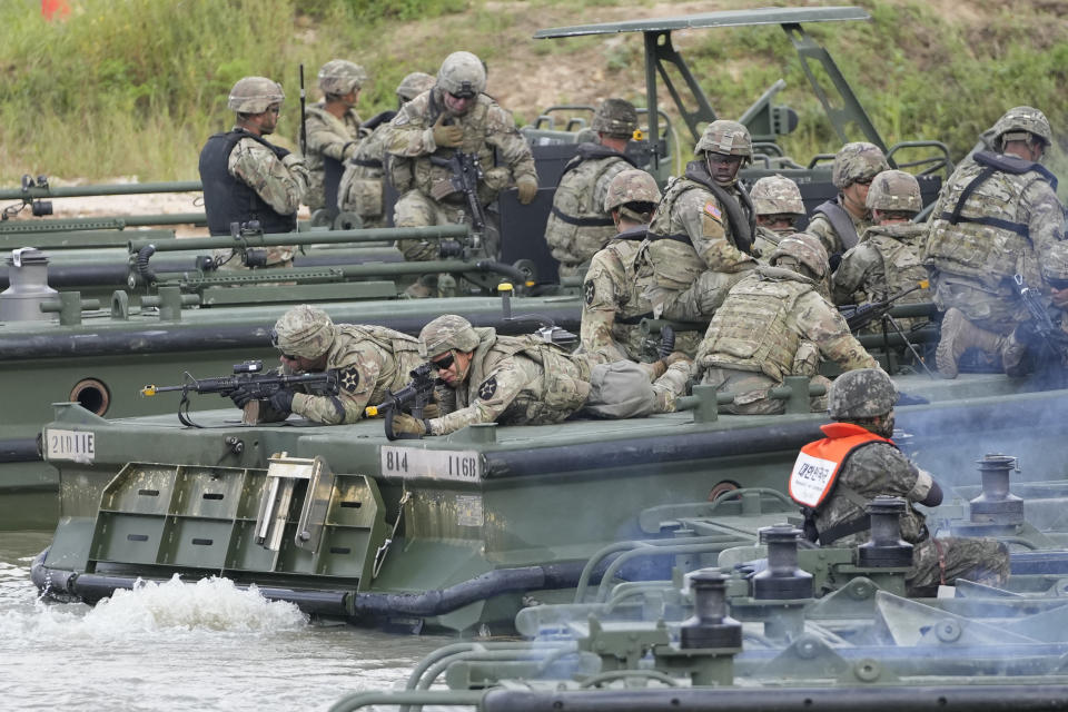 U.S. soldiers and South Korean soldiers sit on the boats during the combined wet gap crossing military drill between South Korea and the United States as a part of the Ulchi Freedom Shield military exercise in Cheorwon, South Korea, Thursday, Aug. 31, 2023. (AP Photo/Lee Jin-man)