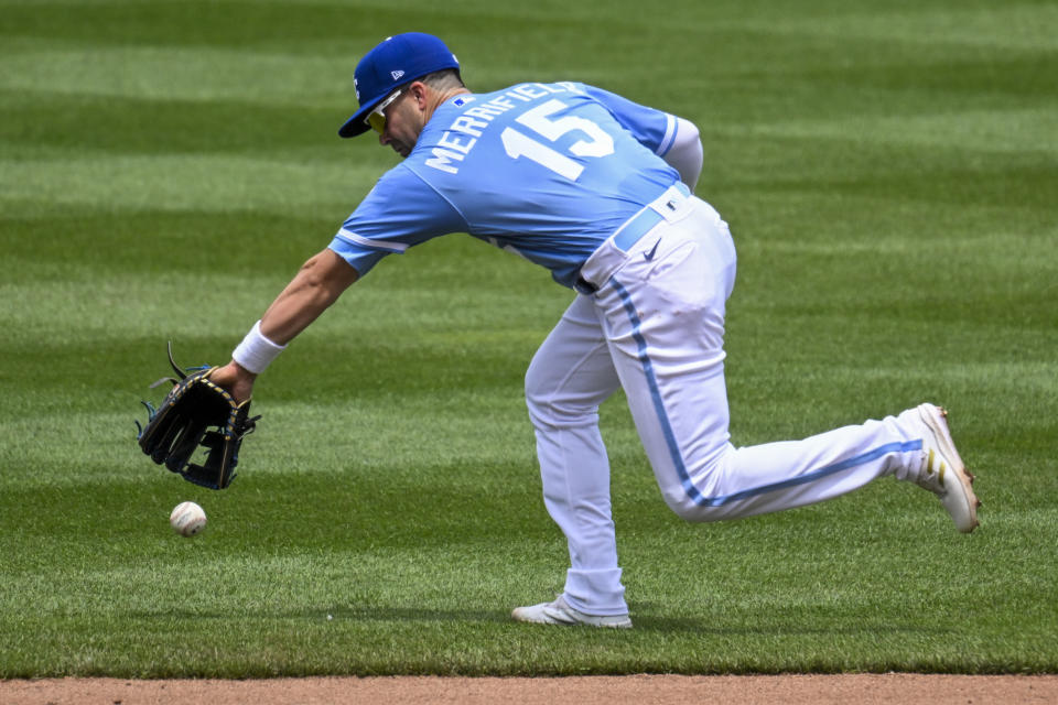 Kansas City Royals second baseman Whit Merrifield cannot come up with a single off the bat of the Houston Astros' Chas McCormick during the fourth inning of a baseball game, Sunday, June 5, 2022, in Kansas City, Mo. (AP Photo/Reed Hoffmann)