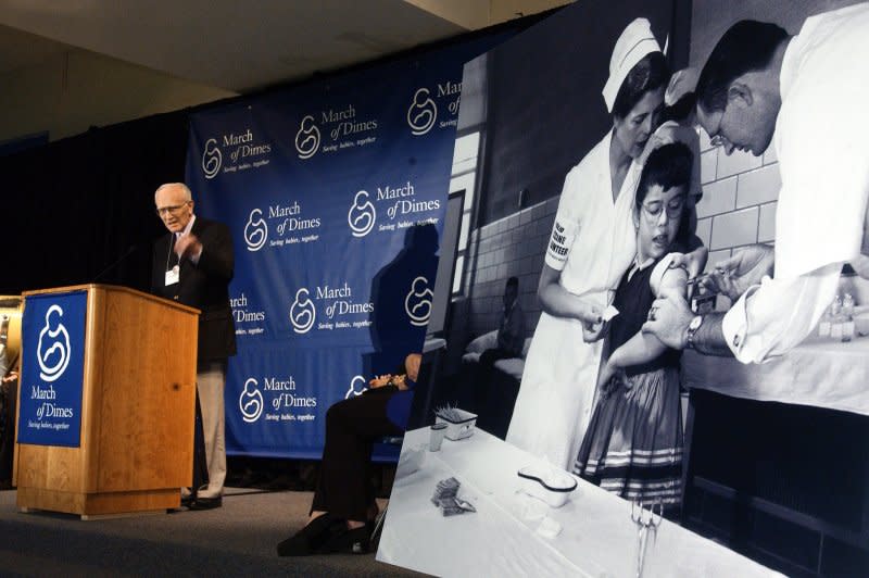 Dr. Richard Mulvaney speaks on the 50th anniversary of the first polio vaccine on April 26, 2004, at Franklin Sherman Elementary School in McLean, Va., the place where the first shots were given. On April 28, 1955, the Public Health Service urged parents to move swiftly in having their children vaccinated for polio. File Photo by Roger L. Wollenberg/UPI