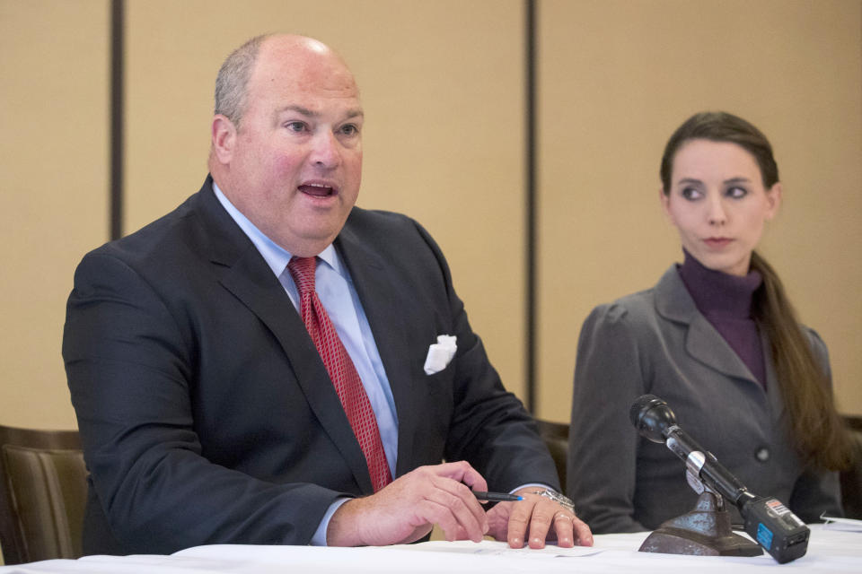 FILE - In a Thursday, Dec. 7, 2017 file photo, Attorney John Manly speaks during a press conference after Michigan sports doctor Larry Nassar was sentenced to 60 years in prison on child pornography charges in Grand Rapids, Mich. As victims' lawsuits move through mediation in pursuit of possible settlements, one looming question is: Who puts a price on that fallout, and how? (Mike Clark/The Grand Rapids Press via AP, File)