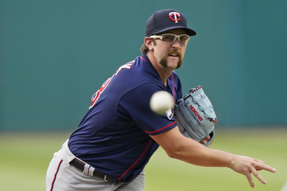 Minnesota Twins starting pitcher Randy Dobnak delivers in the first inning of a baseball game against the Cleveland Indians, Friday, May 21, 2021, in Cleveland. (AP Photo/Tony Dejak)