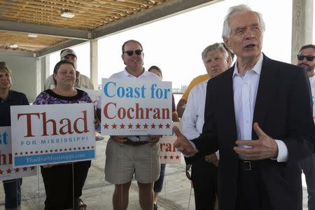 Republican U.S. Senator Thad Cochran (R) speaks to supporters at a dock facility under construction during a campaign stop in the Gulf Coast city of Pass Christian, Mississippi June 19, 2014. REUTERS/Lee Celano