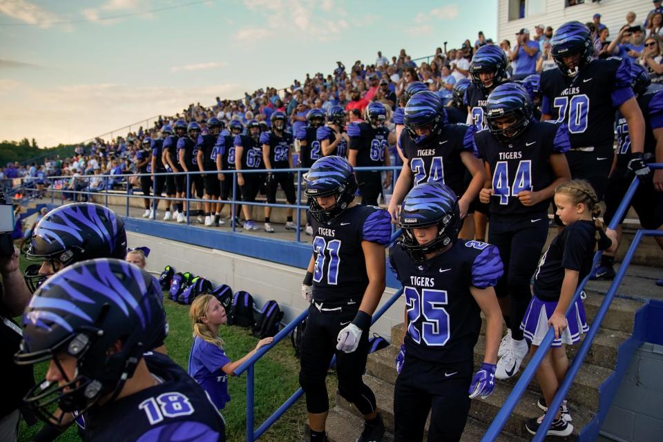 Waverly Central players head to the field before a game against Camden Central at Waverly Central High School in Waverly, Tenn., Friday, Aug. 19, 2022.