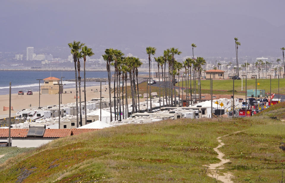 An RV park at Dockweiler State Beach is seen where some coronavirus patients are being quarantined, Friday, April 3, 2020, in Los Angeles. The new coronavirus causes mild or moderate symptoms for most people, but for some, especially older adults and people with existing health problems, it can cause more severe illness or death. (AP Photo/Mark J. Terrill)