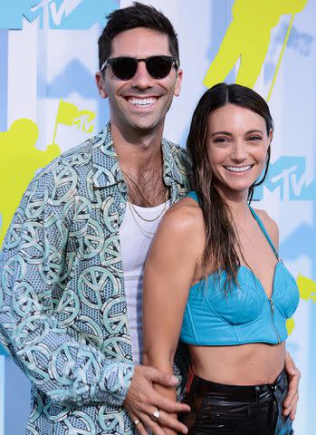 <p>Dimitrios Kambouris/Getty </p> Nev Schulman and Laura Perlongo attend the 2022 MTV VMAs on August 28, 2022 in Newark, New Jersey.