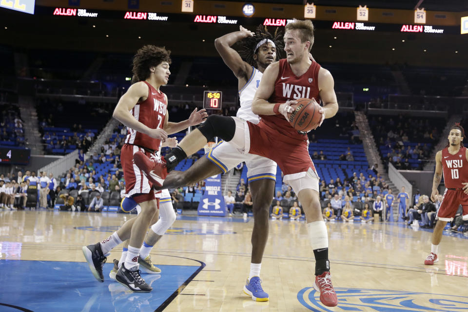 Washington State forward Jeff Pollard grabs a rebound against UCLA during the first half of an NCAA college basketball game Thursday, Feb. 13, 2020, in Los Angeles. (AP Photo/Marcio Jose Sanchez)