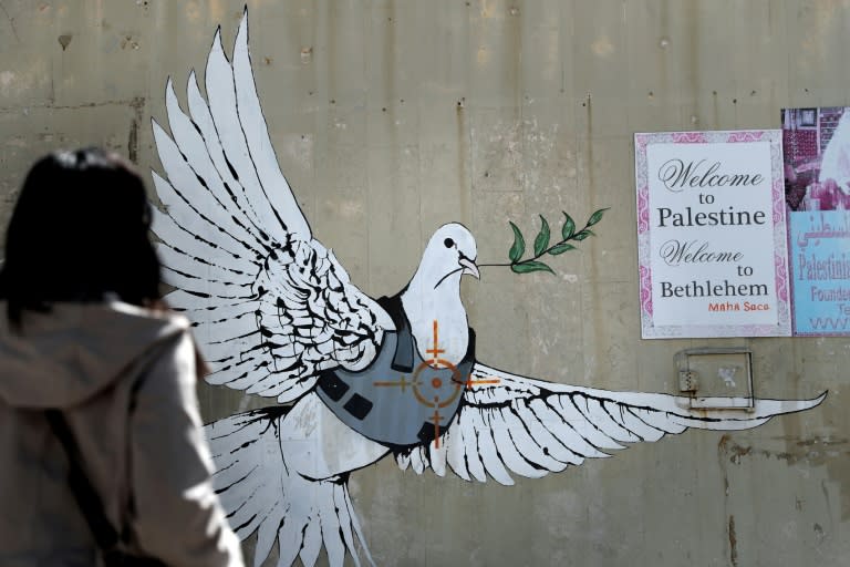 Street art by Banksy shows a dove with a bulletproof vest near his hotel in the occupied West Bank town of Bethlehem