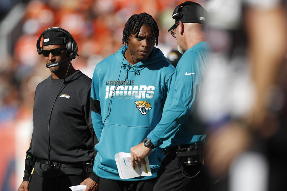 Jacksonville Jaguars cornerback Jalen Ramsey, center, talks with defensive coordinator Todd Wash as he stands on the sidelines during the first half of an NFL football game against the Denver Broncos, Sunday, Sept. 29, 2019, in Denver. (AP Photo/David Zalubowski)