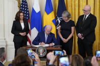 President Joe Biden signs the Instruments of Ratification for the Accession Protocols to the North Atlantic Treaty for the Kingdom of Sweden in the East Room of the White House in Washington, Tuesday, Aug. 9, 2022. From left, Vice President Kamala Harris, Biden, Karin Olofsdotter, Sweden's ambassador to the U.S., and Mikko Hautala, Finland's ambassador to the U.S. (AP Photo/Susan Walsh)