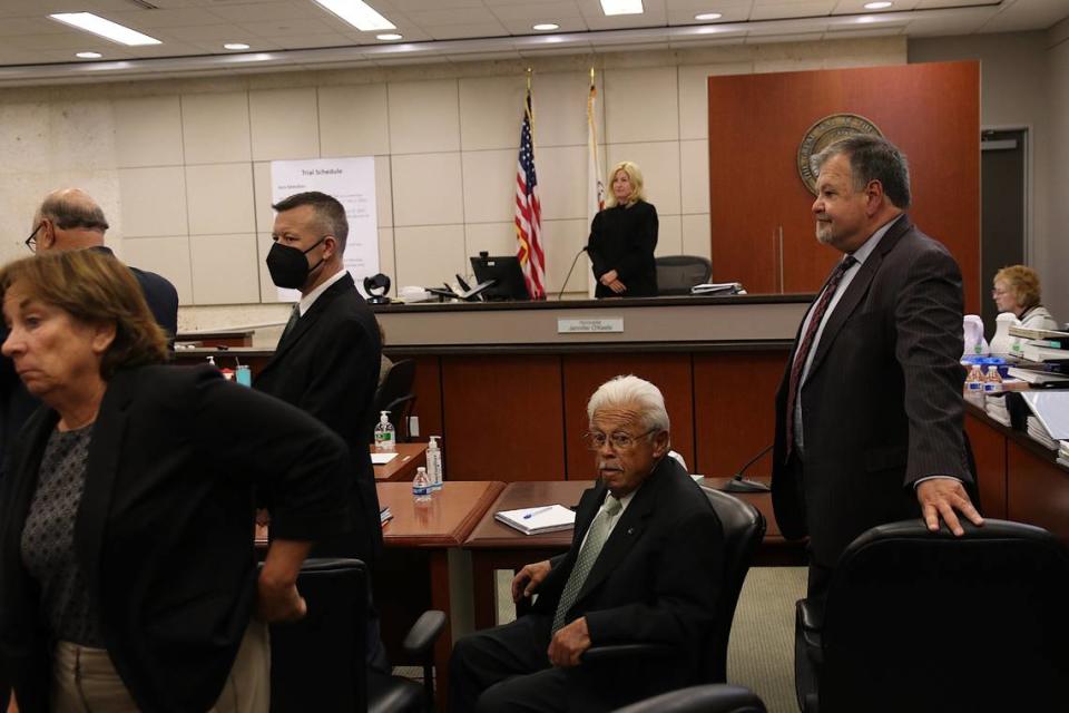 From left to right, Paul Flores, his father, Ruben Flores, Monterey County Superior Court Judge Jennifer O’Keefe and Ruben Flores’ defense attorney, Harold Mesick, appear in Monterey County Superior Court in Salinas on Sept 26, 2022. The two Flores men are on trial in connection with the 1996 murder of Kristin Smart.