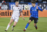 Orlando City's Duncan McGuire, left, challenges CF Montreal's Joaquin Sosa , right, during second-half MLS soccer match action in Montreal, Saturday, April 20, 2024. (Graham Hughes/The Canadian Press via AP)