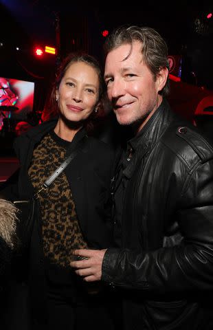 <p>Kevin Mazur/Getty</p> Christy Turlington Burns and her husband Ed Burns attended the Rolling Stones show