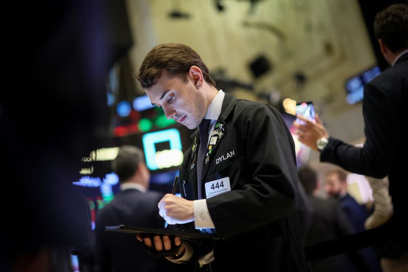 Traders work on the floor of the NYSE in New York