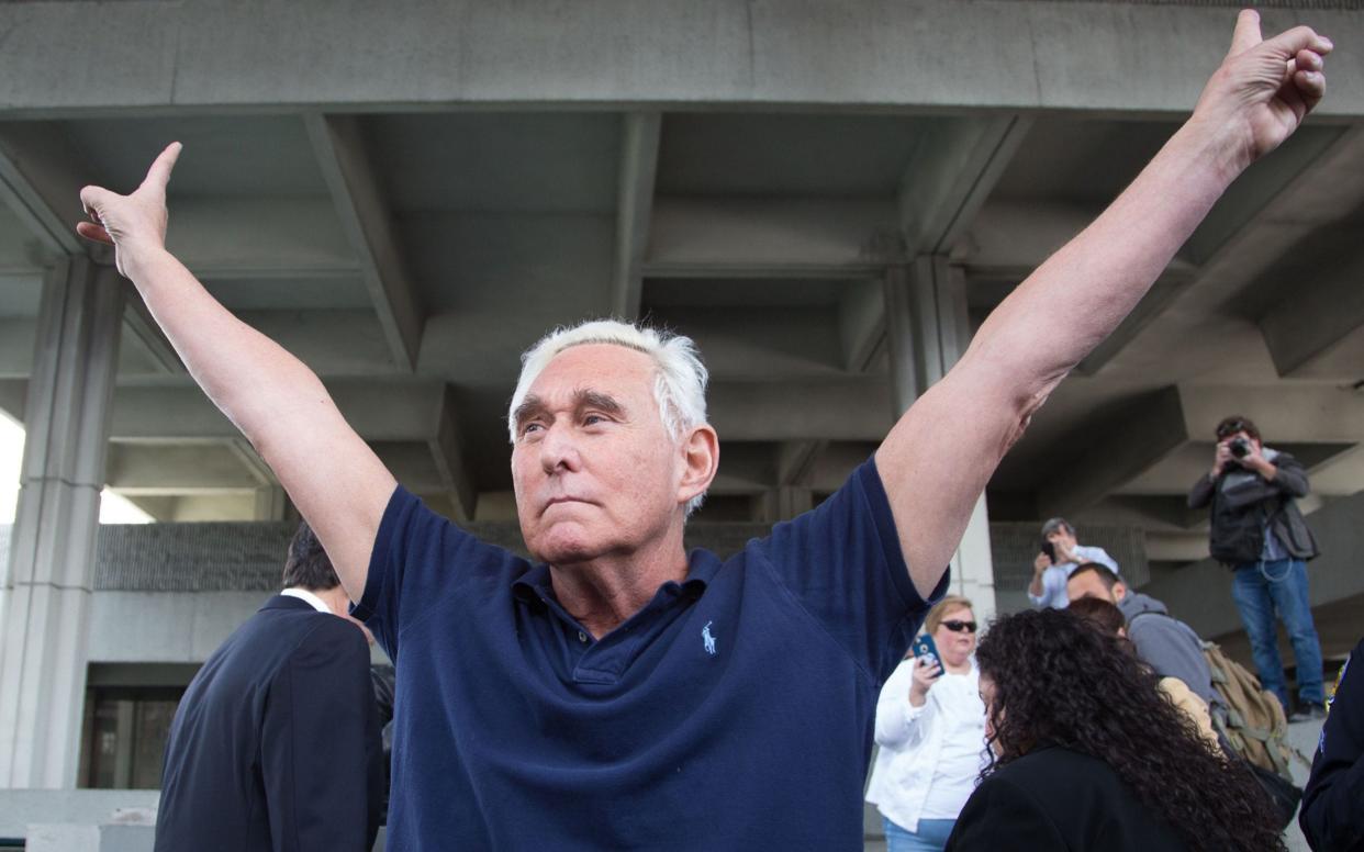 Roger Stone, a longtime adviser to US President Donald Trump, flashes Nixon's famous 