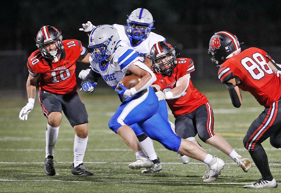 Braintree leading rusher James Curry plows past some North Quincy defenders.

The North Quincy Raiders hosted the Braintree Wamps at Veterans Stadium in Quincy for gridiron action on Friday, Sept. 15, 2023