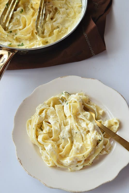 Savory Bites Recipes<p>The perfect Fettuccine Alfredo can be made also at home. This recipe is easy and will guarantee you a restaurant meal experience at home!</p><p><strong>Get the Recipe: <a href="https://www.savorybitesrecipes.com/2014/08/fettuccine-alfredo.html" rel="sponsored" target="_blank" data-ylk="slk:Copycat Olive Garden Fettuccine Alfredo;elm:context_link;itc:0;sec:content-canvas" class="link ">Copycat Olive Garden Fettuccine Alfredo</a></strong></p>