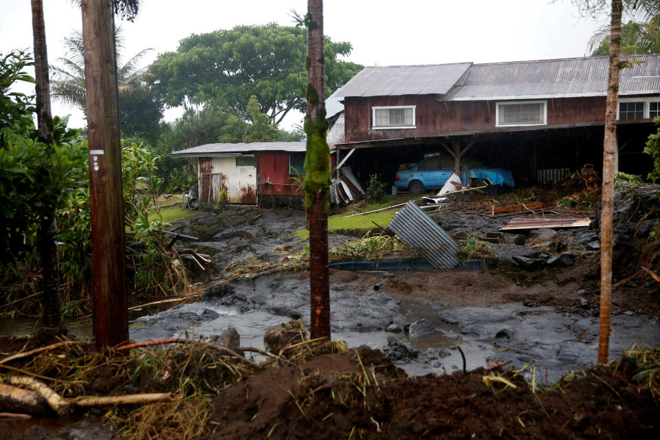 Hurricane Lane's heavy rains caused some flooding for a home in Hilo on Hawaii's Big Island. (Photo: Terray Sylvester / Reuters)