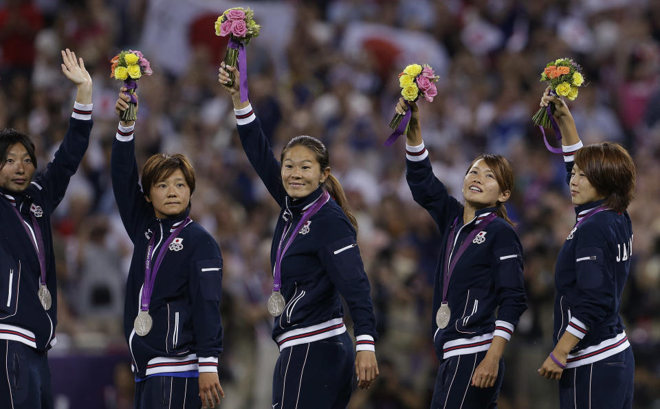 The Japanese women celebrate after earning the silver medal. (AP)