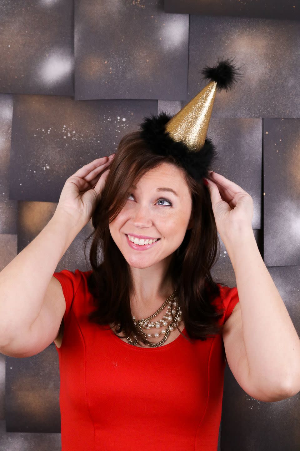 woman wearing a mini party hat headband