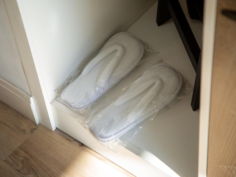 the flip-flops inside a hotel room