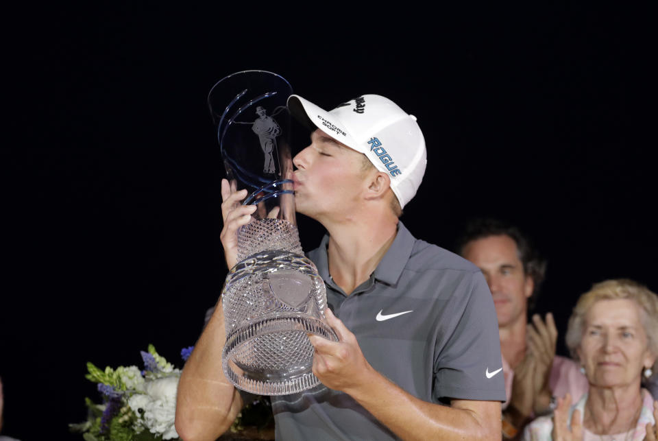 Aaron Wise kissed the trophy after winning the AT&T Byron Nelson, but his girlfriend didn’t appear to want a kiss. (AP Photo/Eric Gay)