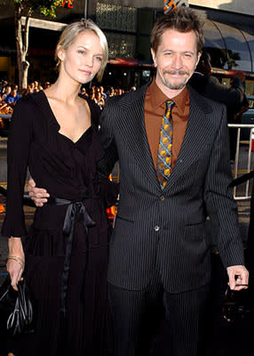 Gary Oldman with Alisa Marshall at the Hollywood premiere of Warner Bros. Pictures' Batman Begins