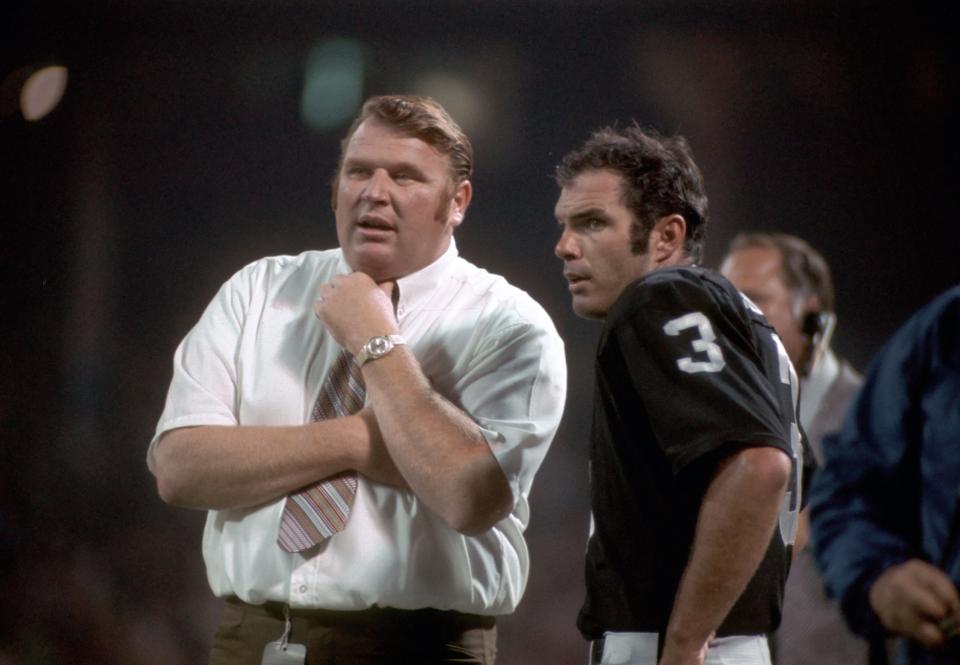 Oakland Raiders coach John Madden huddles with quarterback Daryl Lamonica in this undated file photo. Madden died Tuesday at 85.