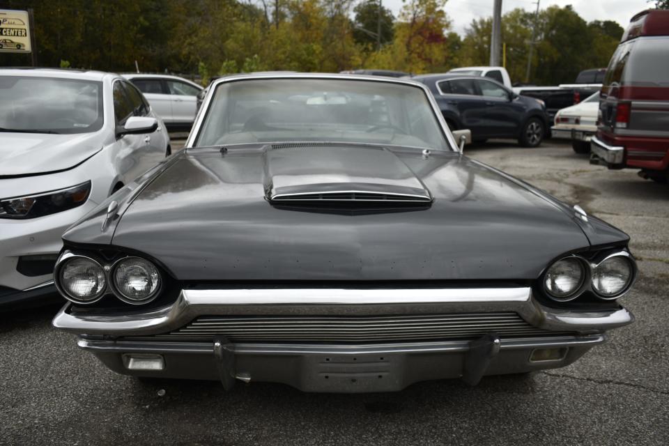 This vintage under-restoration Ford Thunderbird is one of many vehicles parked outside Thurman's Body Shop in Ellettsville. Owner Carl Thurman and son are working on it.