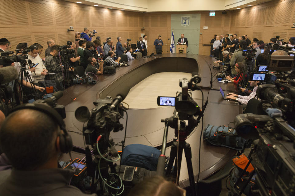 Israeli Defense Minister Avigdor Lieberman delivers a statement at the Knesset, Israel's Parliament, in Jerusalem, Wednesday, Nov. 14, 2018. Lieberman announced his resignation Wednesday over the Gaza cease-fire, making early elections likely. (AP Photo/Ariel Schalit)