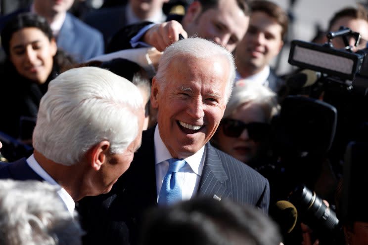 Former Vice President Joe Biden greets members of Congress after an event marking the seventh anniversary of the passing of the Affordable Care Act outside the Capitol Building in Washington, D.C., March 22, 2017. (Aaron P. Bernstein/Reuters)