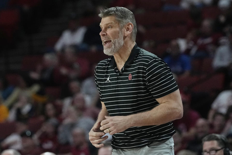 Oklahoma head coach Porter Moser shouts in the second half of an NCAA college basketball game against West Virginia, Saturday, Jan. 14, 2023, in Norman, Okla. (AP Photo/Sue Ogrocki)