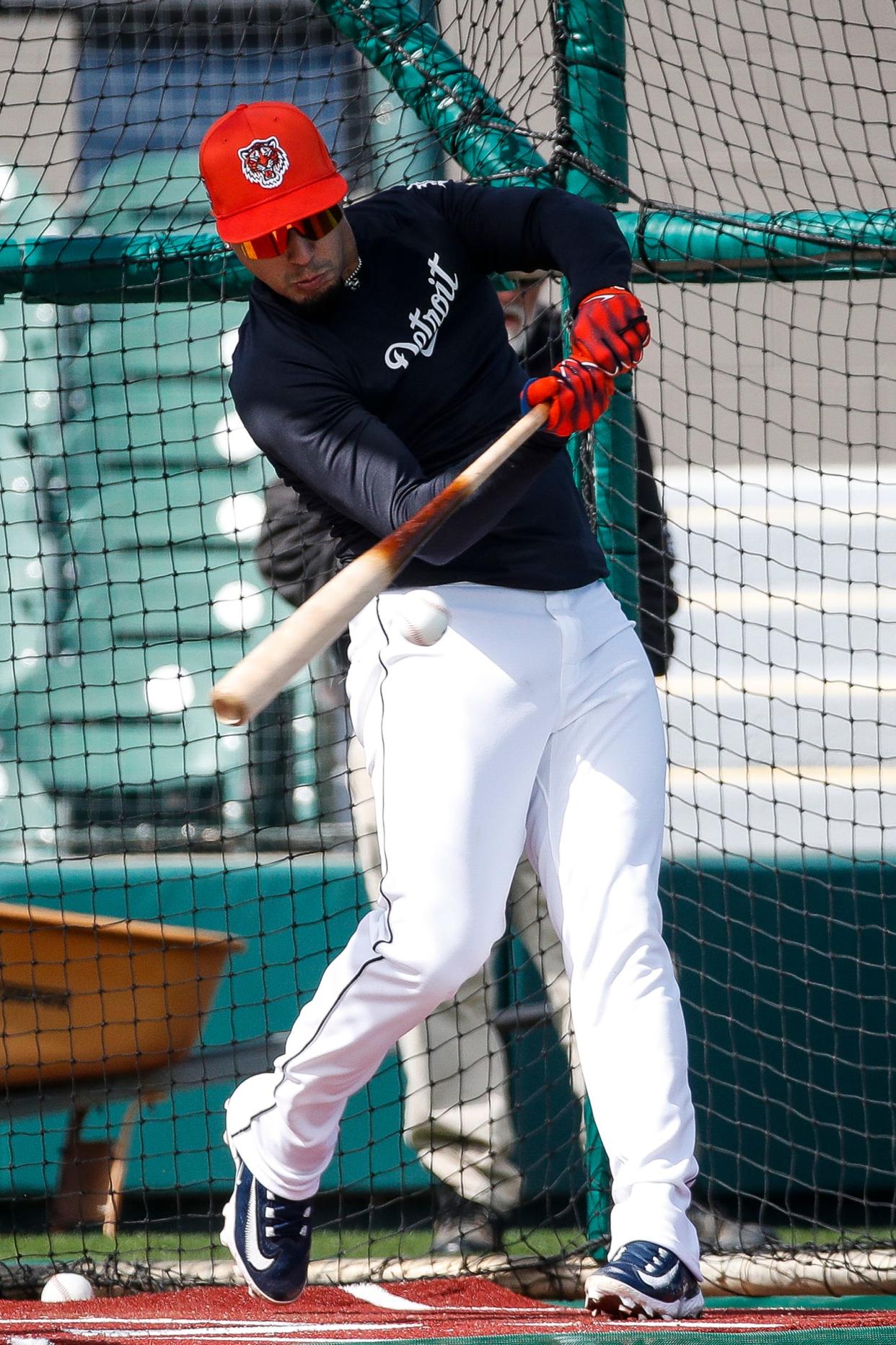 Detroit Tigers shortstop Javier Baez bats at practice during spring training at TigerTown in Lakeland, Fla. on Monday, Feb. 19, 2024.