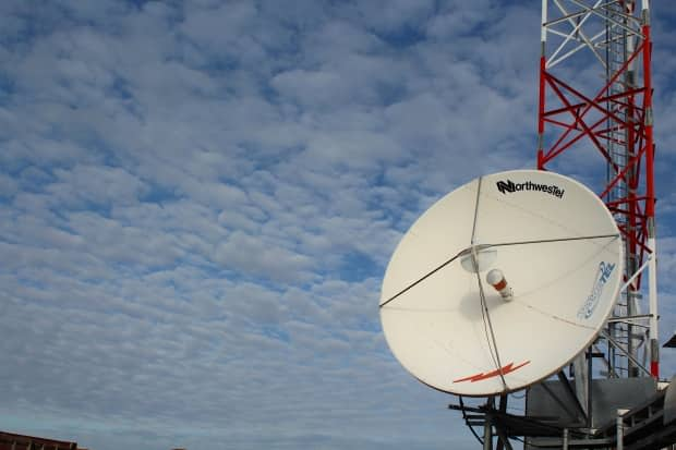 A Northwestel satellite dish in Kugaaruk, Nunavut. Northwestel services in several N.W.T. communities were down Monday after an unspecified issue with one of the company's satellite terminals. (John Last/CBC - image credit)