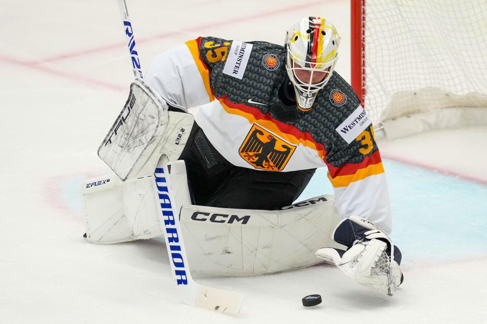 Germany's goalkeeper Mathias Niederberger makes a save during the preliminary round match between United States and Germany at the Ice Hockey World Championships in Ostrava, Czech Republic, Saturday, May 11, 2024. (AP Photo/Darko Vojinovic)