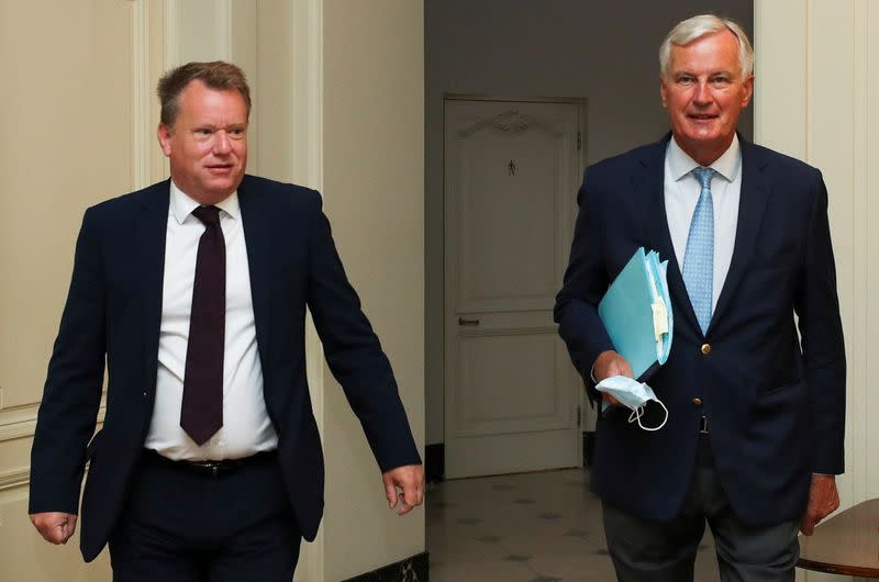 FILE PHOTO: Britain's chief negotiator David Frost and EU's Brexit negotiator Michel Barnier arrive for a meeting, in Brussels